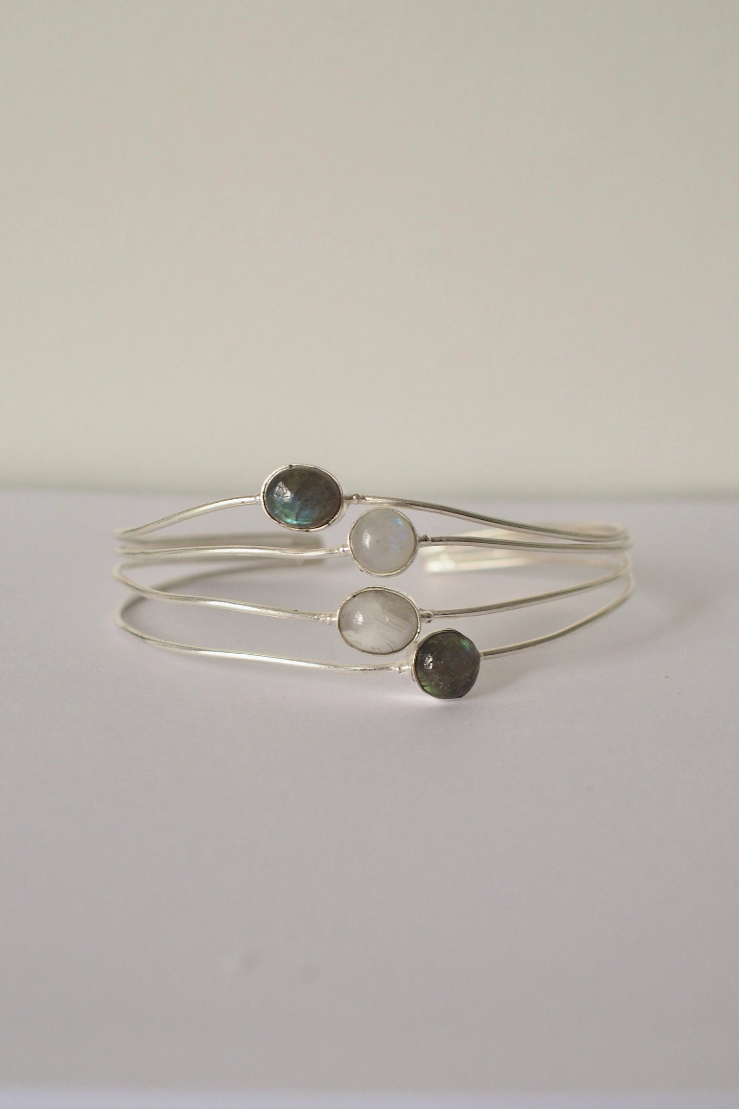 Silver ocean bangle with three gemstones on a white background