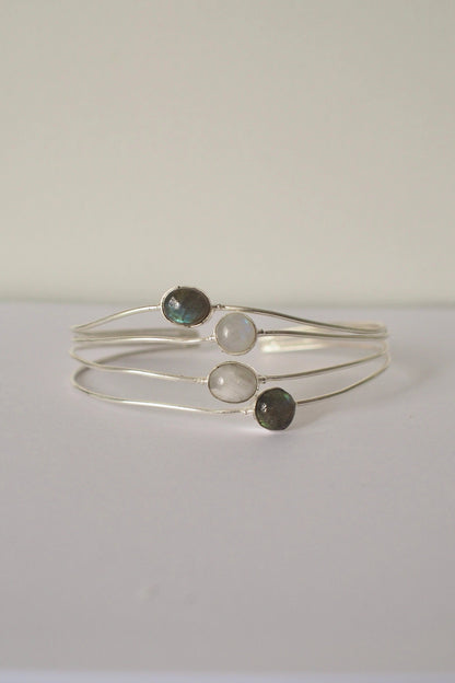 Silver ocean bangle with three gemstones on a white background